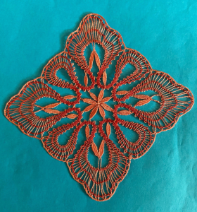 Square shaped diamond lace piece in varigated orange and red