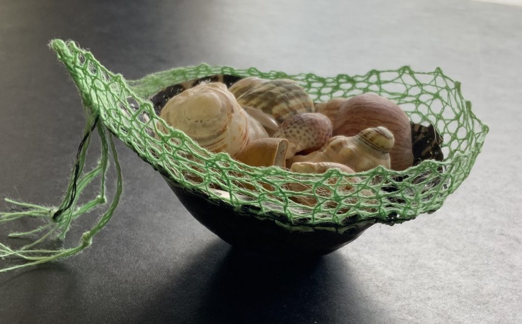 Bowl decorated with lime green lace