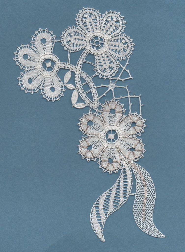 White lace flowers on light blue background